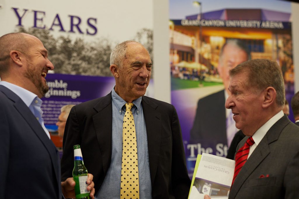 Men talking with Jerry Colangelo at Colangelo Museum grand opening