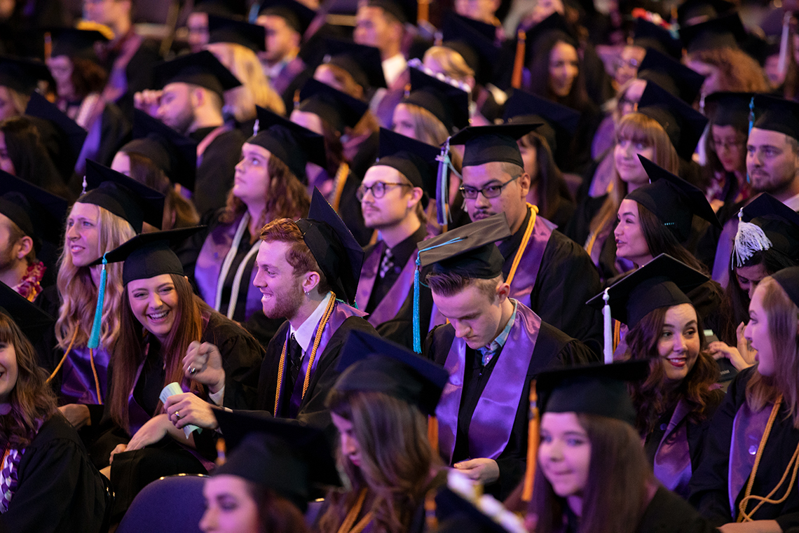 Rows of students at graduation ceremony.